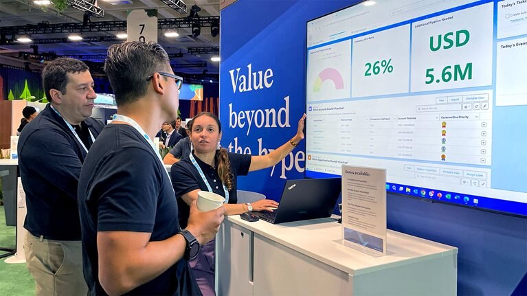 In back, Jorge Clavijo and Juana Valenzuela, McKinsey solution experts, demo AI capabilities