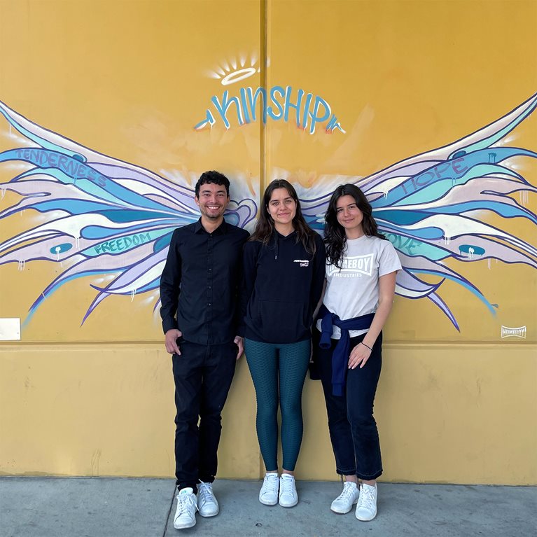 Paula Tanasescu (right) with friends in front of the Homeboy building in Los Angeles