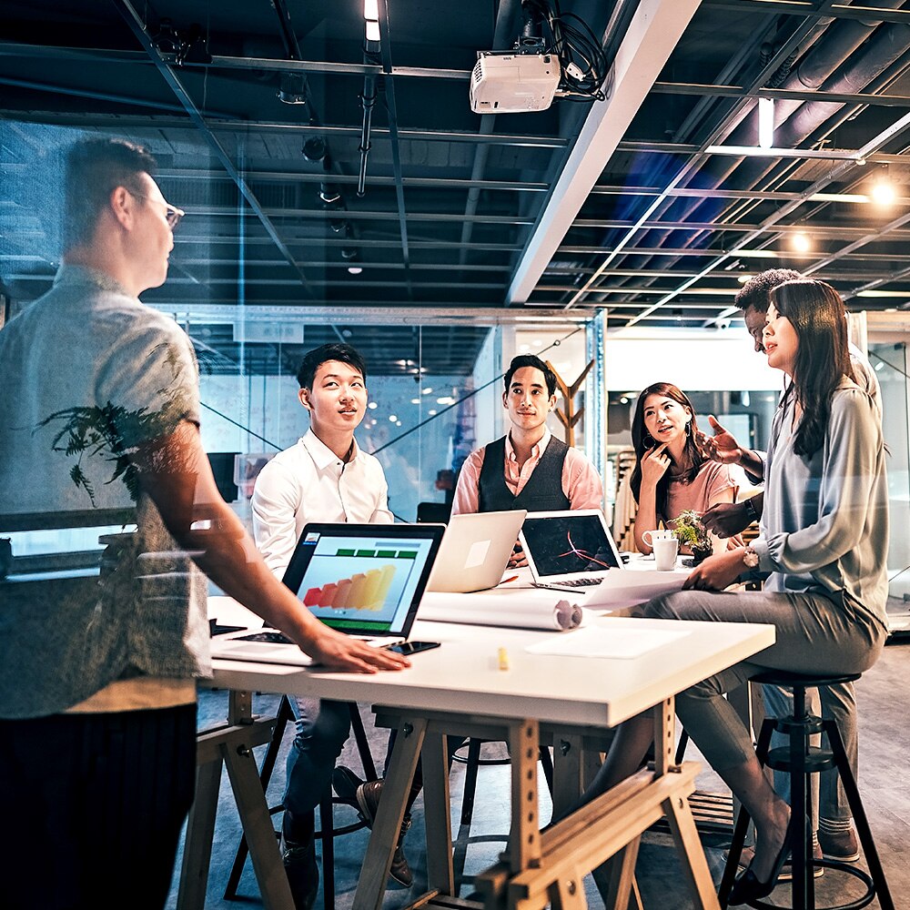 Young Group Of Professionals Developing Business Strategy and Providing The Business Plan