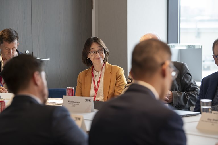 Attendees of Climate Week NYC sitting around a table in discussion