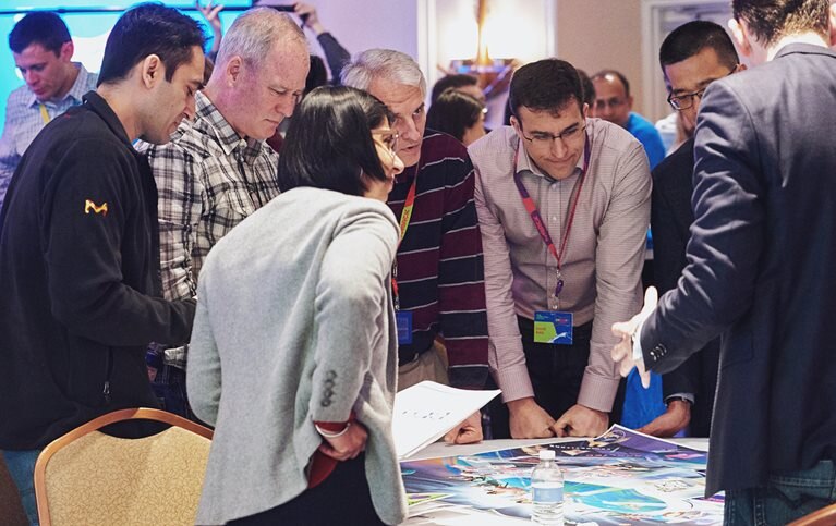 Senior leaders use a specially designed board game to guide employees through all the phases of integration.