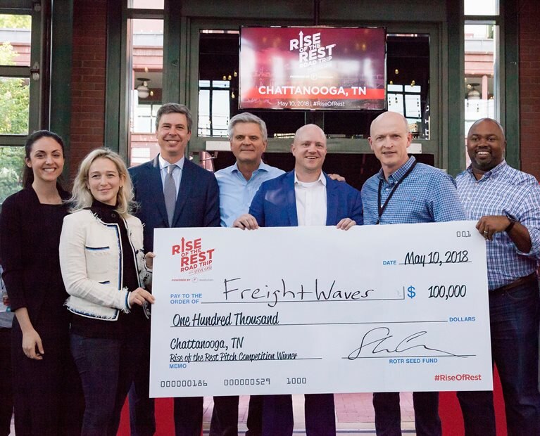 Group of people holding a large check to Freight Waves from the Rise of the Rest roadtrip in Chattanooga, Tennessee.