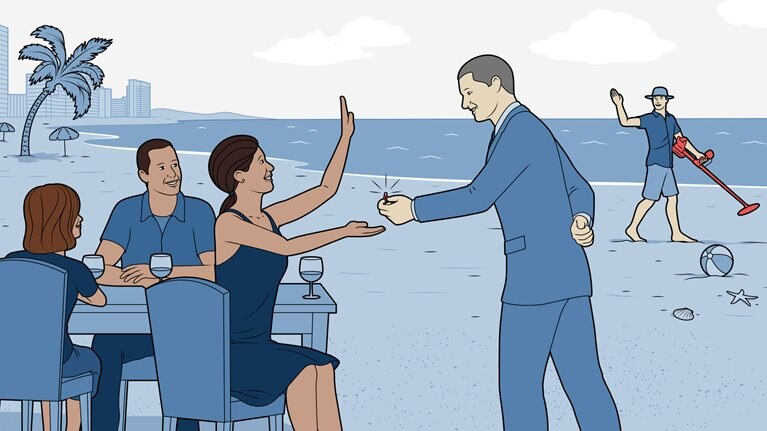 Hotel manager is returning lost ring to a table of guests eating dinner on the beach.