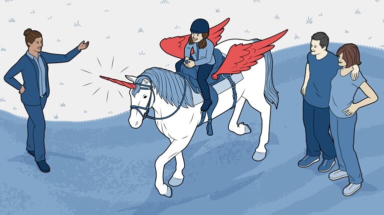 Hotel manager is helping a young girl on a horse that is dressed as a unicorn.